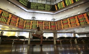 A man rests inside a stock exchange in Kuala Lumpur